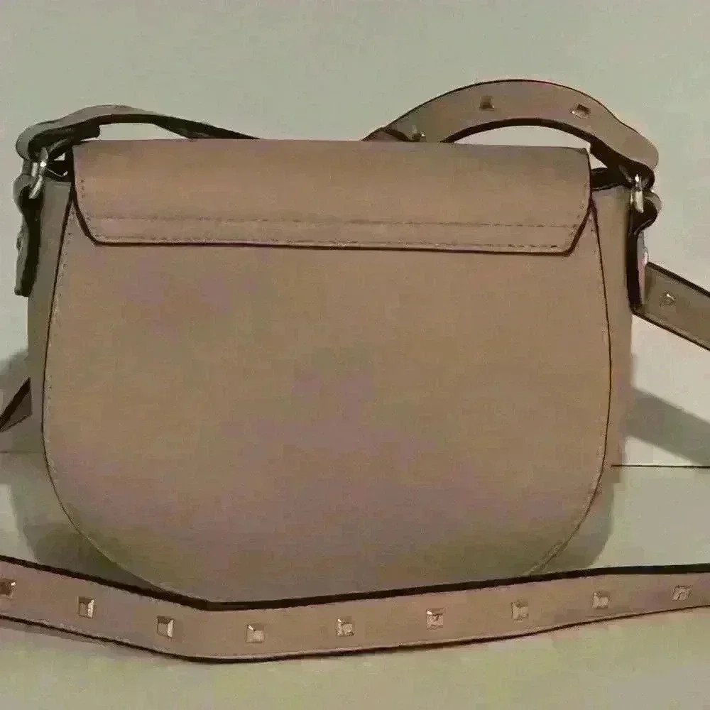 A Victoria’s Secret light pink crossbody bag w/ tassels. - Picture 3 of 9